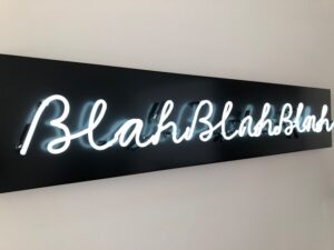 Neon sign saying blah blah blah to denote strange domain names