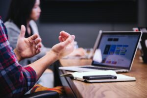 Office scene with man and woman conversing indicating a startup business