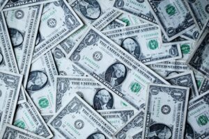 Large stash of US dollars to denote importance of safe escrow services when buying a domain name