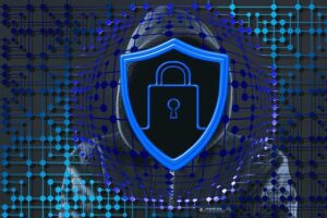 Blue image of a hooded figure whose face is covered by a cyber security style logo to denote an article about the dangers of cyber criminals when managing domain names